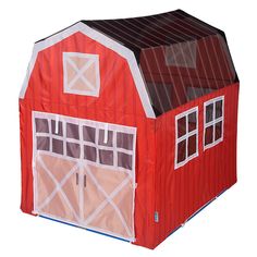 a red barn shaped tent with windows and doors