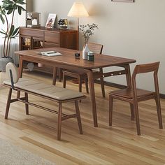 a wooden table and chairs in a room