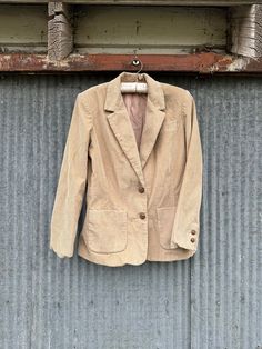 This is a light tan/ beige fitted blazer. Has a satin like material lining. I believe it would best fit a S/M, but please use measurements. It is in good vintage condition  MEASUREMENTS ARE TAKEN LYING FLAT  -17 inches through the chest -15 inches through the waist  -18 inches through the hips -22 inch sleeves  No returns Retro Beige Blazer For Fall, Retro Beige Fall Blazer, Vintage Cream Blazer For Workwear, Vintage Cream Blazer For Work, Vintage Beige Sport Coat For Spring, Retro Single Breasted Beige Blazer, Retro Single-breasted Beige Blazer, Retro Beige Single Breasted Blazer, Retro Beige Single-breasted Blazer