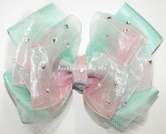 "Pageant Mint Peach Ombre Tutu Hair Bow, Glitzy Mint Green Peach Ombre Organza Satin Hair Bow, Over The Top Pageant Bow, Flower Girls Seafoam Coral Hair Bow, 1st Birthday Mint Coral Peach Bows Large 4.5\" Mint Green Peach Tutu Bow Hand Set Embellished with Clear Rhinestones attached to a choice of an alligator clip, locking French barrette or attached to a matching 5/8\" Skinny Stretchy Band - Headband Choice Size  Price: $22.99 add Double the Rhinestones shown $4.00 FREE US Shipping. No Coupon Code Needed. Need a Quick Ship? Shipping Upgrades Available at Checkout. ----------------------------------------- Item will ship out within 1 - 3 business days from receipt of payment. Larger orders may take 1 - 2 days longer.  International orders buyers responsible for country duty fees, addition Mint Green Accessories, Coral Hair, Pageant Hair, Tulle Bow, Mint Coral, Bow Barrette, Tulle Bows, Over The, Satin Tulle