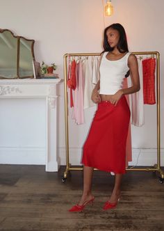 Rosalie Skirt in Ruby Cut from semi-sheer silk chiffon, the ‘Rosalie’ Skirt has a slinky slip silhouette that skims the body and falls to a flowy hem. Finishing touches include a scalloped elastic waistband and a blush pink rosette. Wear high or low waisted. Made ethically in New York City Composition: 100% Silk Dry clean only Models wear a size xs Elastic waistband allows for flexible sizing Feminine Flowy Skirt For Night Out, Fitted Bias Cut Maxi Skirt For Summer, Summer Sheer Asymmetrical Skirt, Chic Sheer Flowy Skirt, Chic Sheer Flowy Maxi Skirt, Sheer Asymmetrical Skirt For Summer, Summer Silk Bottoms With Bias Cut, Summer Silk Bias Cut Bottoms, Bias Cut Flared Skirt