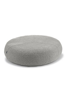 a round dog bed with a grey cover on the top and bottom, sitting in front of a white background