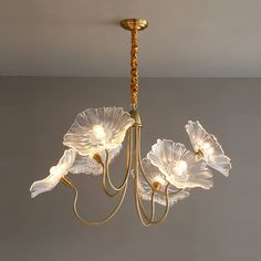 a chandelier with flowers hanging from it