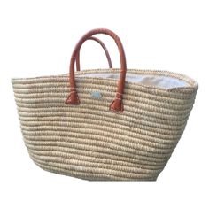 "Straw Tote Bag. French Market Basket. Summer Straw Bag. The true colour is photo 1.   A summer essential, our Tote Bag is a stylish and practical accessory. Carefully woven from raffia it is perfect for everyday travels to fit all your essentials, the interior is equipped with a lined drawstring top to keep your items hidden from view. This gorgeous straw bag is finished with our optional metal hippie fish logo in gold or silver. Perfect for your next vacation and many more after that, elevate Beach Satchel Bag With Handles, Travel Bucket Bag With Rolled Handles, Eco-friendly Straw Travel Bag With Rolled Handles, Beige Bucket Bag With Rolled Handles For Travel, Large Capacity Basket Bucket Bag For Travel, Beach Tote Bag With Rolled Handles, Everyday Summer Beach Bag With Rolled Handles, Natural Beach Bag With Rolled Handles For Daily Use, Summer Travel Bag Rectangular