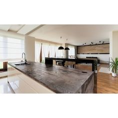 a large kitchen island in the middle of a room