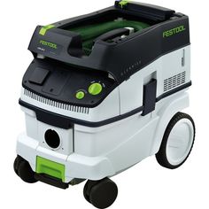 a green and white floor scruber sitting on top of a black and white cart