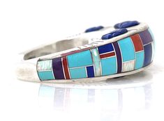 New, one of a kind Ben Nighthorse bracelet! Sterling silver inlaid with turquoise, coral lapis, sugilite and white opal. 7/8” wide, sits 3/4” high and is a size 6 1/2. Multicolor Inlay Sterling Silver Bracelets, Multicolor Sterling Silver Bracelet With Inlay, Multicolor Inlay Cuff Bracelet Gift, Multicolor Sterling Silver Bracelets With Inlay, Artisan Multicolor Cuff Bracelet With Inlay, Artisan Multicolor Inlay Cuff Bracelet, Artisan Multicolor Bracelets With Inlay, Multicolor Artisan Bracelet With Inlay, Multicolor Artisan Inlay Bracelets