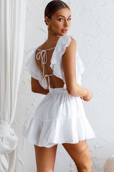 White romper  Lined  Ruffle trim detail  Open back with string ties  Zipper in back of shorts   Make an entrance in our pretty Always My Girl romper. Perfect for Summer day pool parties teamed with wedges and a tote. We are obsessed with that open back with string-tie detail. You're sure to get noticed in this one! Cute Ruffled Bubble Romper For Vacation, Cute Bubble Romper With Ruffles For Vacation, Cute Summer Bubble Romper With Ruffled Straps, Cute Bubble Romper With Ruffled Straps For Summer, Summer Bubble Romper With Ruffles For Beach, Cute Summer Bubble Romper With Smocked Back, Cute Bubble Romper With Smocked Back For Summer, Cute White Jumpsuit For The Beach, Summer Beach Mini Jumpsuits And Rompers