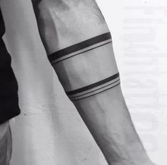 a man's arm with two black lines on it