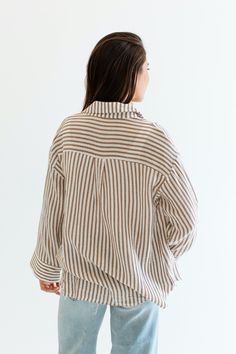 Stay cool and stylish this summer with our Zuma Button Down, featuring pretty iridescent buttons and a raw hem. This super lightweight top offers an effortless, relaxed, and roomy fit, making it perfect for warm weather. Best of all? Its 100% cotton! Wear it buttoned up for a polished look or unbuttoned over a swimsuit or tank for a breezy, casual vibe. This versatile piece is a must have summer staple! Malibu Collection FIT Relaxed Roomy Fit Iridescent Buttons High-Low Raw Hem Savannah is 5'8 W Large Buttons, Lightweight Tops, Summer Staples, Stay Cool, Polished Look, Savannah Chat, Warm Weather, This Summer, High & Low