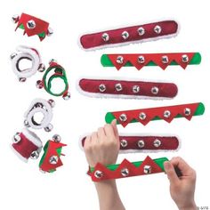 a person is making christmas decorations with scissors and other items in the shape of santa's hats