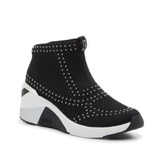 Skechers-Hands Free Slip-Ins: A Wedge Sneaker Bootie Complete with sleek accents and a sporty style, the Hands Free Slip-Ins: A Wedge sneaker bootie from Skechers will liven up any casual look. This simple silhouette is crafted with silvertone studs and metallic accents that polish up the pair. Complete with maximum cushioning and a lace-free closure that makes these kicks comfortable and easy to wear. Sporty Wedge Sneakers For Sports, Sporty Wedge Heel Sneakers For Sports, Black Synthetic Wedge Sneakers For Spring, Black Synthetic Sporty Wedge Sneakers, Black Sporty Synthetic Wedge Sneakers, Black Synthetic Wedge Sneakers, Modern Black Wedge Heel Sneakers, Sporty Mid-top Synthetic Wedge Sneakers, Modern Synthetic Wedge Sneakers For Sports