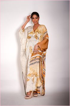 This super gorgeous kaftan. This dress is the perfect definition of a luxury kaftan. Has a belt inside that can be tight around the waist to give a nice snatch. Fun and easy to wear. Elegant Brown Thobe For Eid, Elegant Long Kimono For Vacation, Chic Floor-length Kaftan For The Beach, Elegant V-neck Abaya For Summer, Chic Floor-length Beach Kaftan, Elegant V-neck Summer Abaya, Chic Floor-length Kaftan For Vacation, Elegant V-neck Kimono For Vacation, Long Beige Dress For Eid