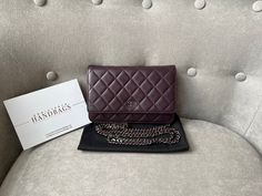 Overview Chanel Wallet on Chain in Aaubergine Lambskin Leather with Dark Silver Hardware. The ultimate evening style, the classic Chanel WOC is timeless and features the CC hardware detailing on the front flap. Lambskin leather is luxurious and soft in texture. Perfect for evening wear or night out to carry the essentials. Can be carried as a handheld clutch with the chain tucked inside, or over shoulder or cross body. Lovely dark purple shade. Features Aubergine Lambskin Leather Silver toned ha Dark Purple Shade, Chanel Wallet On Chain, Chanel Woc, Classic Chanel, Evening Style, Chanel Wallet, Wallet On Chain, Handbag Wallet, Wallet Accessories