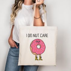 I Do Nut Care Tote Bag, Canvas Tote Bag, Shopping Bag, Gift For Women, Gift for Men, Birthday Gift Bag, Bridal Gift Tote Bag, Library Bag This 100% cotton bag comes in one size - 15" x 16"- perfect for everyday wear. While the canvas material will show off your designs in great colors, it's durable and will last for years. The bag features 20" handles (made from the same canvas), making it easy to carry even with a week's worth of shopping. .: 100% cotton canvas .: Heavy fabric (12 oz/yd² (406.9 g/m .: Sewn-in label .: Available in natural and black colors Novelty Rectangular Bag For Everyday Use, Novelty Rectangular Bags For Everyday, Novelty Rectangular Everyday Bag, Library Bag, Men Birthday, Birthday Gift Bags, Canvas Making, Bridal Gift, Bag Canvas