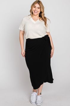 Details A soft knit maternity plus size wrap midi skirt featuring an elastic waist band and an adjustable tie. Content + Care 63% Polyester 34% Rayon 3% Spandex Dry Clean or Hand Wash Cold, No Bleach, Color Separate, Hang or Line Dry Import Size + Fit Length: 33" Measured From: 1X Product Code: 73153 Model Stats: Height: 5'9" Bust: 47" Hips: 48" Wearing Size: 1X Plus Size Pregnancy Fashion, Plus Size Maternity Outfits, Maternity Business Casual, Plus Size Maternity Clothes, Pregnancy Fashion Fall, Casual Maternity Outfits, Wrap Midi Skirt, Preggo Fashion, Midi Skirt Outfit