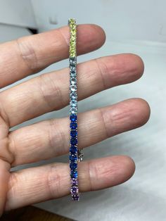 Vintage Cubic Zirconia Bracelet Clear rainbow Crystal Tennis 7.5 inches All jewelry is shipped free in the US in a nice gift box. Check out our over a THOUSAND great reviews Engraving is $4 per letter and is not always perfect depending on the piece. It can take a few days if the jeweler is busy. This is payable to Paypal Judithsltd@gmail.com Multicolor Cubic Zirconia Tennis Bracelet For Formal Occasions, Formal Multicolor Cubic Zirconia Tennis Bracelet, Elegant Rainbow Bracelets For Parties, Handset Stones Bracelet Jewelry Gift, Handset Stones Bracelet Jewelry For Gift, Luxury Multicolor Tennis Bracelet As Gift, Multi-stone Cubic Zirconia Bracelets As Gift, Multi-stone Cubic Zirconia Tennis Bracelet As Gift, Multicolor Cubic Zirconia Tennis Bracelet For Anniversary