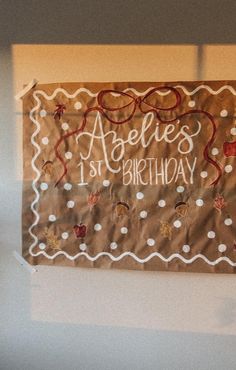 a brown birthday banner hanging on the wall