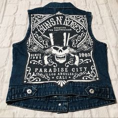 Handmade Guns N’ Roses Denim Shirt Vest Size: Xs Pit To Pit 16-17”In Length 20”In Dark Wash Blue Jean Denim Vest Cropped Vest Fitted Cut Off Sleeves; Sleeveless Button Front W/Silver Oversized Buttons Details Functional From Pockets Skull And Crossbones Vintage Rock Band Logo Western Cowboy Font Collared “Appetite For Destruction” “Paradise City, Los Angeles, California” Country Classic Rock Music Festival Kill Star Marilyn Manson Rockstar Concert Flannel Goodwill Bohochic Thrift Beatles Cowboy Font, California Country, Rock Music Festival, Kill Star, Rock Band Logos, City Los Angeles, Paradise City, Band Logo, Shirt Vest