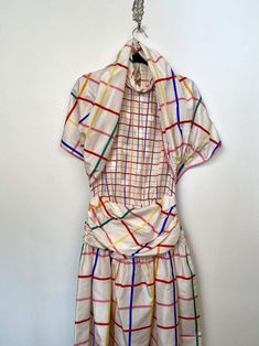 Geoffrey Beene Part Two Rainbow Plaid Pop Art Silk Polkadot Dress XS SMeasurements taken flat unstretched and approximate; 19” underarm 13” waist 53” length3 buttons at the topSide zipper Has matching belt/ shawl depending how you wear Fitted Multicolor Dresses For Daywear, Multicolor Retro Silk Dress, Retro Multicolor Silk Dress, Retro Multicolor Dresses For Daywear, Designer Multicolor Spring Dress, Spring Retro Dress With Ruched Details, Retro Spring Dresses With Ruched Details, Lined Multicolor Daywear Dresses, Retro Ruched Dress For Spring