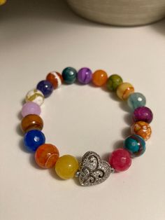 Mixed beaded bracelet with silver pave' heart focal bead Sold as singles Focal Bead, Beaded Bracelet, Jewelry Bracelets, Accessory Gift, Beaded Bracelets, Display Homes, Electronic Accessories, Ships, Purses And Bags