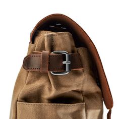 Stay organised on the go with this versatile men's messenger bag. Features a main compartment with four inner pockets, a padded laptop section, and two accessible front pockets under the flap. The side pockets accommodate a water bottle or umbrella, while the secure back pocket offers extra space. Constructed from durable canvas and enhanced with timeless leather accents. Leather Shoulder Bag With Anti-theft Pocket For Outdoor, Functional Satchel Saddle Bag For Travel, Functional Saddle Bag Satchel For Travel, Outdoor Leather Shoulder Bag With Anti-theft Pocket, Functional Brown Saddle Bag For Travel, Outdoor Leather Bag With Anti-theft Pocket, Outdoor Brown Laptop Bag With Adjustable Strap, Rectangular Leather Bags With Functional Pockets, Leather Bags With Functional Pockets For Everyday Use