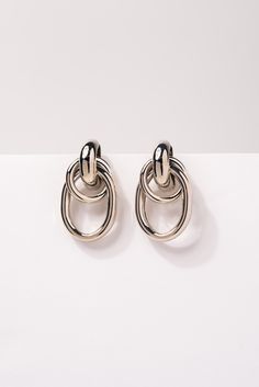 These elegant earrings are a must-have accessory for any fashion-forward individual. Made with high-quality materials, they exude sophistication and style. The double hoop design adds a unique touch, making them stand out from ordinary earrings. SizeHeight: 1.25 inWidth: 0.75 in QualityCrafted with gold/silver-plated high-quality environmentally friendly light, strong, metal alloy. Secures onto earlobe with post backings. ImportedE12425S Hoop Design, Link Earrings, Earrings In Gold, The Double, Elegant Earrings, First They Came, Gold And Silver, Everyday Look, Environmentally Friendly