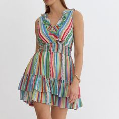 New With Tags Get Ready To Turn Heads On Your Next Vacation With Our Entro Fiesta Stripe Sleeveless Ruffle Dress! Perfect For Soaking Up The Sun And Dancing Under The Stars, This Playful Dress Brings A Burst Of Fun To Your Getaway Wardrobe. With Its Vibrant Stripes And Flirty Ruffle Details, It's The Ultimate Vacation Essential For Making Unforgettable Memories In Style &Amp; Comfort! Details Available In Sizes: S L Color: Blue Combo Stripe Print In Blue, Red, Orange &Amp; Green Sleeveless Tank Spring Sleeveless V-neck Dress With Ruffles, V-neck Sleeveless Dress With Ruffles For Day Out, Sleeveless Ruffle Dress For Garden Party In Summer, Summer Sleeveless Ruffled Dress, Multicolor Ruffled Sundress For Summer, Summer Sleeveless Mini Dress With Ruffles, Summer Pink Sleeveless Dress With Ruffles, Multicolor Vacation Dresses With Ruffled Straps, Pink Ruffled Sleeveless Dress For Summer