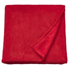 a red blanket folded on top of a white background