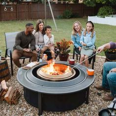 a group of people sitting around a fire pit