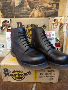 These are an original, and truly vintage pair of Made in England Dr Martens.  They are a 6 hole boot finished in a black grain leather. This leather is very robust. This boot has a steel toe cap front and trademark cushioned sole. They were made back in the 1980s, and are brand new still. These are a UK size 9, European 43, men's USA 10. Vintage Black Work Boots With Round Toe, Vintage Black Plain Toe Work Boots, Industrial Leather Boots With Round Toe, Industrial Style Leather Boots With Round Toe, Vintage Black Steel Toe Work Boots, Vintage Black Work Boots With Steel Toe, Vintage Black Combat Boots With Reinforced Toe, Dr Martens White, Leather Work Boots