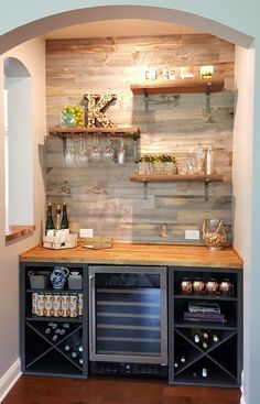 a wine bar with shelves and bottles on the wall