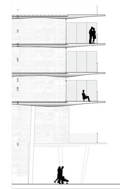 two people are standing on the top floor of a building, and one person is sitting down