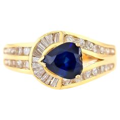 The ring is finely crafted in 14k yellow gold with diamonds weighing approximately total of 0.65 carat and sapphire weighing approximately total of 1.42 carat. Circa 1980.