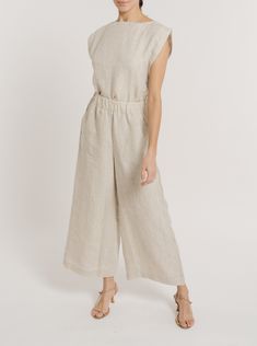 Discover the epitome of comfort and style with our Everyday Pant. Boasting an elastic waistband and a loose, wide-leg fit, this pant achieves the ideal balance between ease and sophistication. Crafted from our premium organic linen, its elegant length adds to its versatile appeal. Pair it effortlessly with our High-low Top for a laid-back look, or opt for our Tie Front Blouse for a more sophisticated ensemble. 25" Inseam. Made with organic linen Lined with organic cotton Handmade in India Machin Chic Linen Wide Leg Lounge Pants, Versatile Beige Linen Wide Leg Pants, Chic Linen Wide Leg Pants With Straight Hem, Spring Neutral Linen Wide Leg Pants, Relaxed Fit Linen Wide Leg Pants With Straight Hem, Elegant Linen Pants With Elastic Waistband, Elegant Relaxed Fit Linen Pants, Beige Wide Leg Pants With Relaxed Fit, Beige Wide Leg Pants With Straight Hem