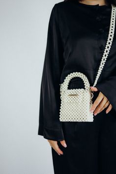 Elegant Beaded Top Handle Bag, Chic Wedding Bags With Pearl Handle, Chic Pouch Shoulder Bag With Pearl Handle, Chic Shoulder Bag With Pearl Handle And Pouch Shape, Elegant Tote Shoulder Bag With Pearl Handle, Elegant Tote Evening Bag With Pearl Handle, Elegant Evening Tote Bag With Pearl Handle, Small Elegant Bag For Everyday Use, Luxury Pearl Bag As Gift