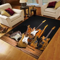 a living room filled with lots of guitars on top of a wooden floor next to two couches