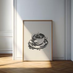 a black and white drawing of a coffee cup sitting on top of a saucer