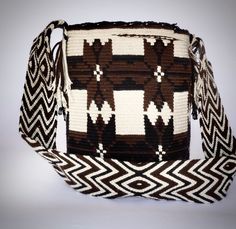 Mochila purse made by artisans of the Wayuu Indigenous Group in Colombia Purchased directly from Artisan, on a Fair Trade Basis Fully Handmade For each Wayuu Mochila Bag purchased, Hands of Colombia donates thread to Indigenous Artisans. Only ONE available Wayuu Mochila Purses are famous for their stunning designs and unique character. Each purse is handmade, full of expression and character. SIZE - Large. 12 inches deep (30.5cm), 13 inches wide (33cm). Comfortably fits large items: use as an ev Mochila Bag, Handmade Purse, Handmade Purses, Fair Trade, Unique Fashion, Fashion Statement, Purse, Pattern