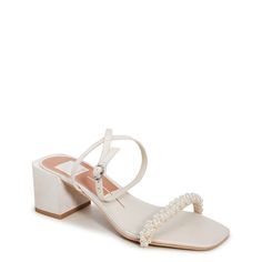 Elevate your dressy look to the next level with these women's Dolce Vita Zalima vanilla (white) heeled evening sandals. Fashioned with textile upper, these dressy sandals flaunt a trendy square open toe, appealing decorative faux pearl beads at the toe strap, and an adjustable ankle strap with buckle closure for that perfect fit. The synthetic outsole with covered block heel completes the look. | Dolce Vita Women's Zalima Evening Sandal in Vanilla Size 6 Medium Dressy Sandals, Evening Sandals, White Heels, Dolce Vita Shoes, Shop Sandals, Pearl Beads, Wedge Heels, Shoes Boots, Wedge Sandals