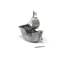 a metal model of a pirate ship on a white background