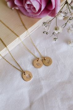 Hand-stamped with care, these necklaces serve as a beautiful reminder of the love and admiration you hold for the special people in your life. Whether it's a playful daisy for April, the elegant rose for June, or the cheerful chrysanthemum for November, there's a birth month flower to suit everyone in your life! Choose one or multiple birth month flowers to add to your necklace as a precious reminder of those you hold close to your heart. NECKLACE SPECIFICATIONS: * Disc Size: 3/8"  * Chain Lengt Gold Flower Necklace, Birth Flower Necklace, Birth Month Flower, Month Flowers, Birth Month Flowers, Birth Flower, Gold Flower, Necklace Personalized, Special People