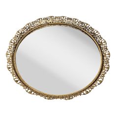 a round mirror with intricate designs on the edges and gold trimmings is shown