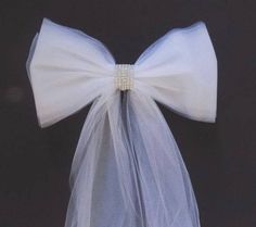 a white bow tied to a black background