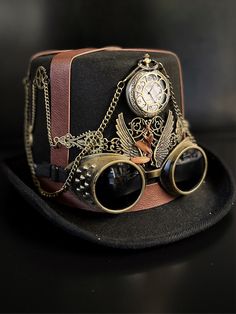 Our brown/black steampunk hat with goggles radiates sophistication, join the steampunk revolution and claim your spot among the fashion-forward. Perfect for themed events, cosplay, or adding a dash of steampunk to your everyday attire.


Age Group/Gender - Adult/Unisex

Size/Type - One size fits all adults
Color - Brown/Black Vintage Hat Costume Accessories For Cosplay, Vintage Hat For Cosplay, Vintage Top Hat With High Crown For Cosplay, Vintage High Crown Top Hat For Cosplay, Steampunk Brimmed Halloween Costume Hat, Vintage Brimmed Costume Accessories, Steampunk Brimmed Costume Hats For Themed Events, Steampunk Top Hat With High Crown For Themed Events, Steampunk Brimmed Costume Accessories For Party