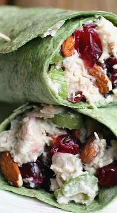 two wraps filled with chicken salad and cranberries on top of each other