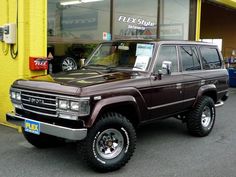 a brown truck parked in front of a building