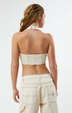 Revamp your style with the PacSun Halter Corset Vest – a chic choice. This top showcases a flattering halter neckline, sleeveless arms, a sleek zipper closure on the front, a cropped hem, and eye-catching flattering seams. The finishing touch comes with button closures at the neck, adding a touch of sophistication to your look.


	V-neckline
	Stretch fabric
	Halter strap with snap-button closure
	Flattering seams
	Cropped
	95% Cotton, 4% polyester, 1% spandex
	Machine washable
	Model is we Fitted Beige Halter Neck Tank Top, Beige Fitted Halter Neck Tank Top, Chic Summer Cami Halter Top, Chic White Backless Tube Top, Fitted Halter Neck Crop Top For Day Out, Fitted Backless Halter Top For Day Out, Chic Backless Tank Top For Summer, White Backless Halter Top For Summer, Chic Backless Summer Tank Top