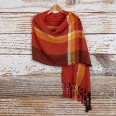 With the changing colors of the leaves in the fall in mind, the Ulloa family of artisans from Peru design this gorgeous shawl in flame, marigold, mahogany and wine. The shawl is hand-woven on artisanal looms with 100% alpaca and its shades are so full of life that will make any outfit stand out. Fall Handwoven Alpaca Shawl, Brown Alpaca Shawl For Fall, Handwoven Shawl For Fall, One Size, Handwoven Brown Scarves For Fall, Handwoven One-size Shawl For Fall, Traditional Brown Shawl For Fall, One Size Alpaca Scarves For Fall, Fall Handwoven Alpaca Scarf, Fall Alpaca Handwoven Scarves