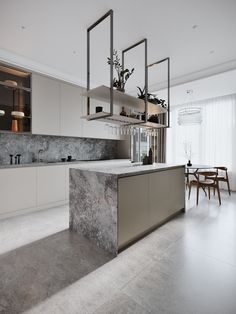 a modern kitchen with marble counter tops and stainless steel appliances